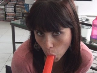 Hailey blows a popsicle